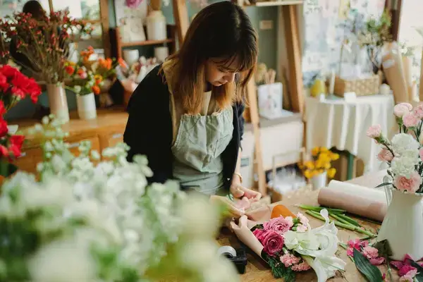 Student creating bouquet