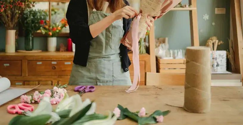 Student is packing her first bouquet
